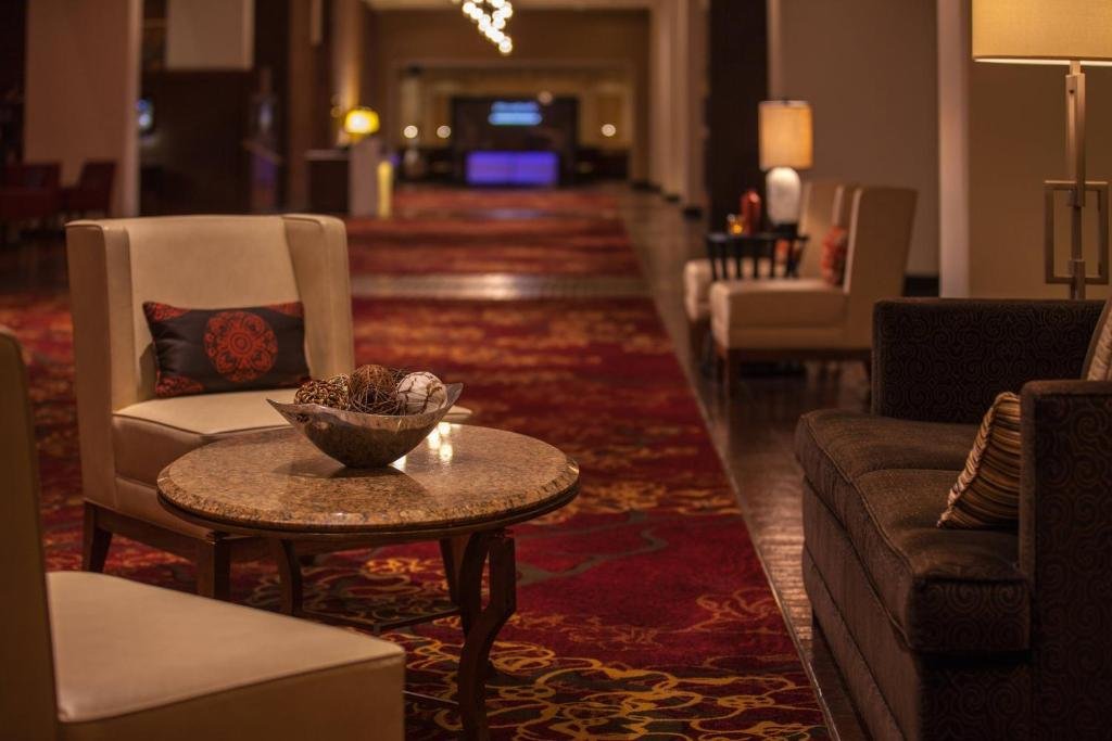 Cozy hotel lounge with warm lighting and a round table
